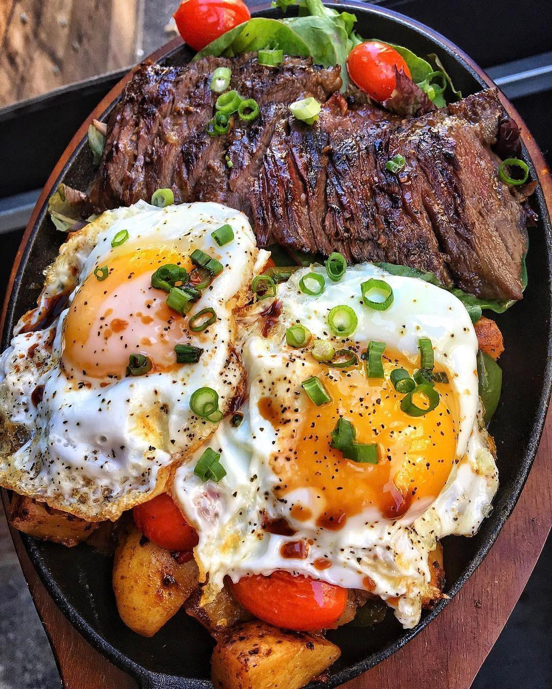 Breakfast Steak Recipe
 Steak and eggs over pan fried potatoes with peppers and