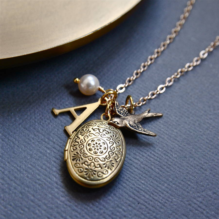Charm Locket Necklace
 personalised locket necklace with bird charm by penny