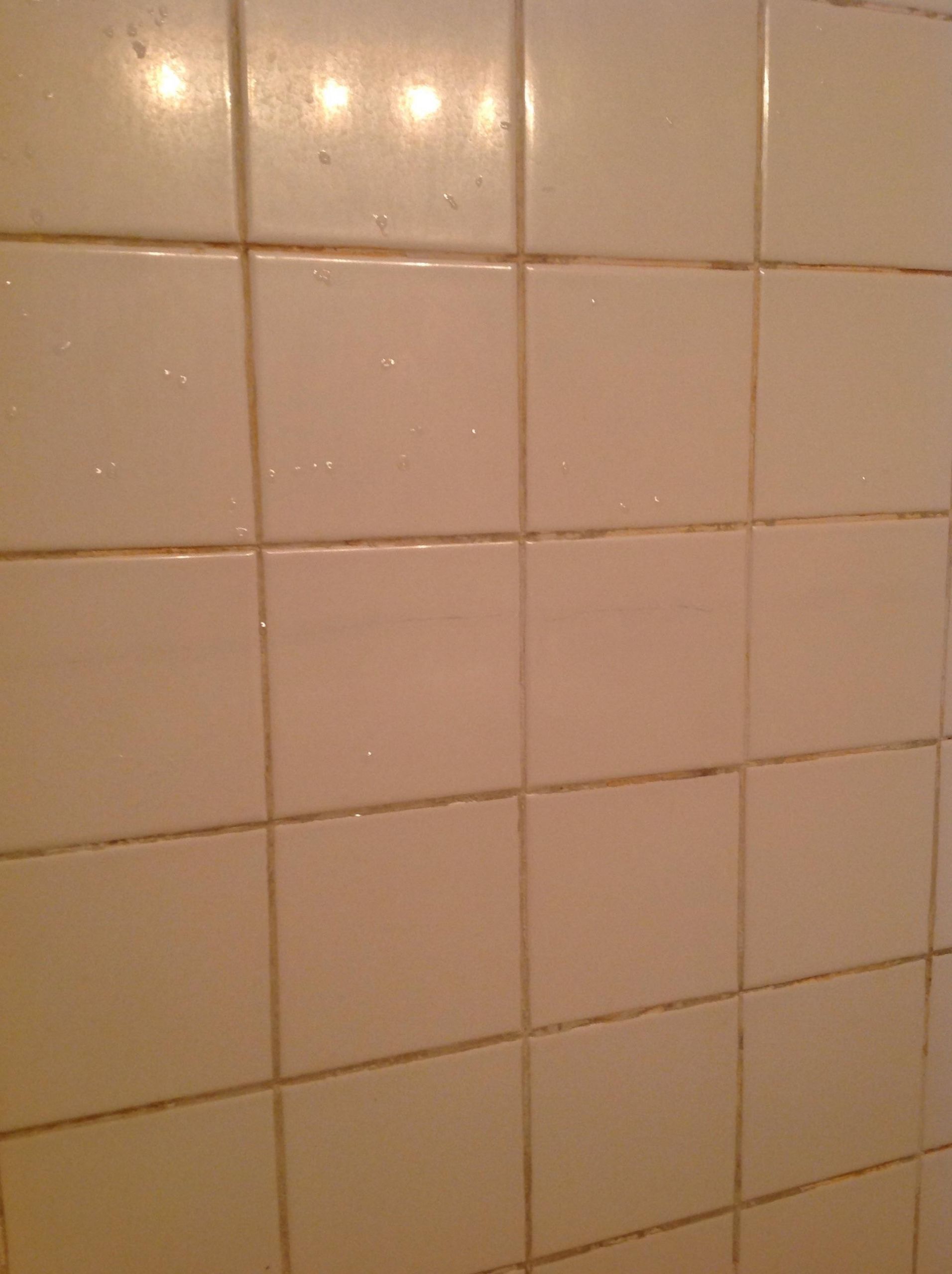 Repairing Bathroom Tiles
 repair Cracked bathroom tile runs almost entire length