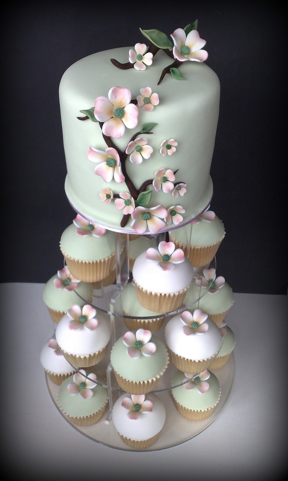 Wedding Cake Cupcakes
 Small Things Iced Dogwood Wedding Cupcakes & Cutting Cake