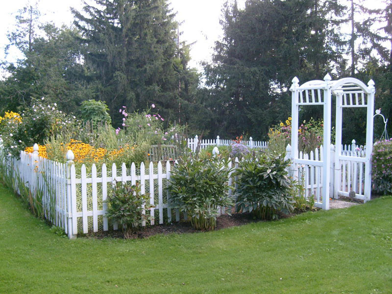 White Backyard Fence
 Two Men and a Little Farm the Fence a White Picket