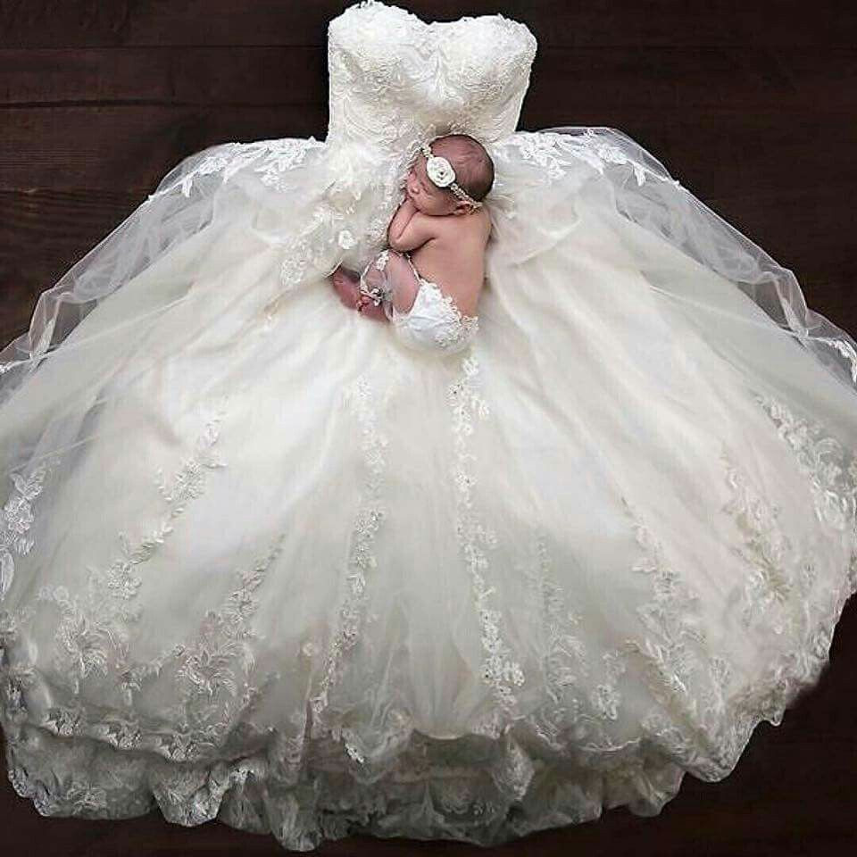 Baby Wedding Dresses
 Newborn laying on wedding dress
