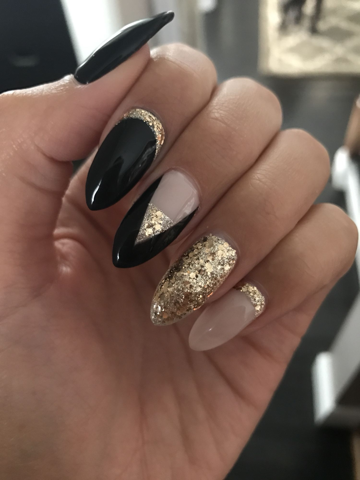 Black And Gold Nail Ideas
 Black and gold coffin nails