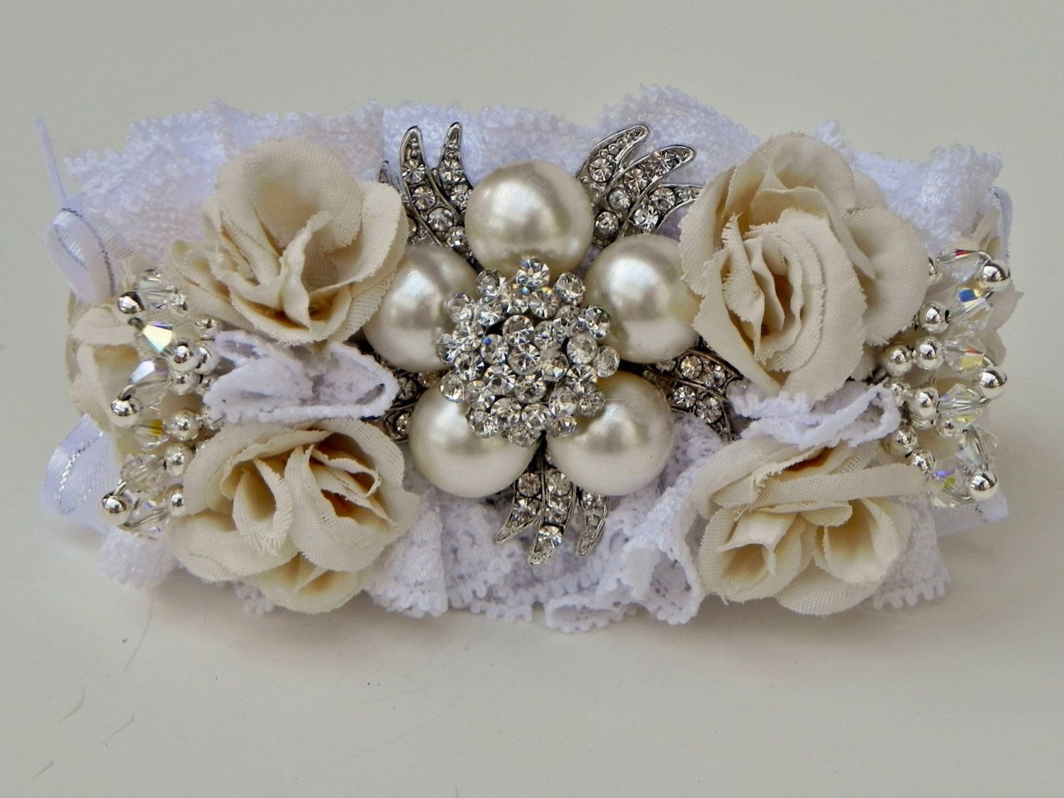 Brooches Corsage
 Brooch Wrist Corsage Ivory and White $40 00 via Etsy