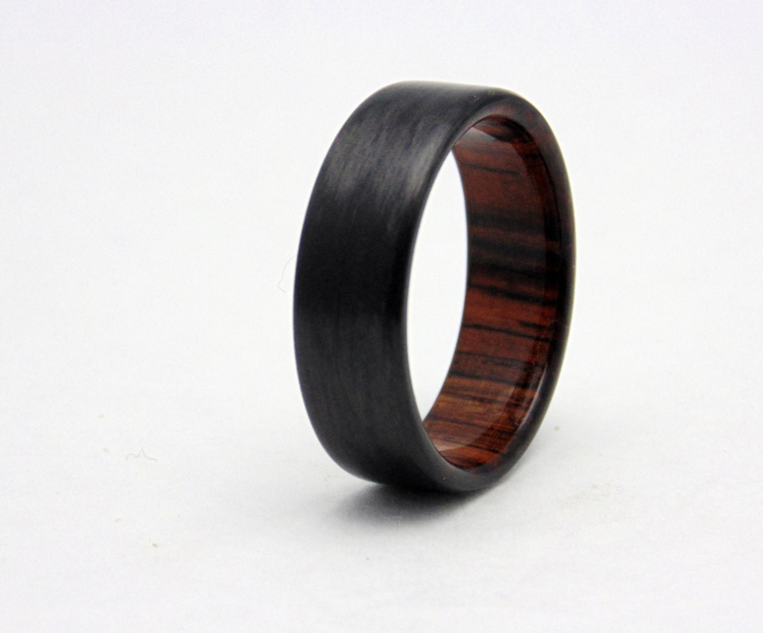 Carbon Fiber Wedding Rings
 Carbon fiber wedding band with Cocobolo wood Handmade carbon