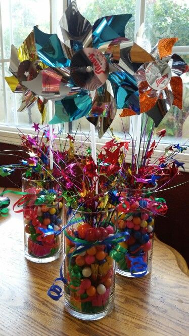 Cheap Birthday Decorations
 Pinwheel centerpiece Using Ballon weights vase and