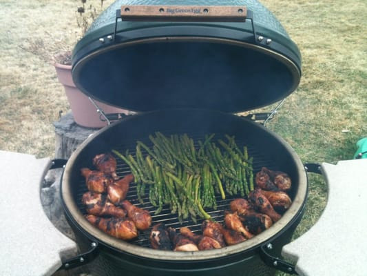 Chicken Thighs On Big Green Egg
 Chicken legs and asparagus on a XL Big Green Egg
