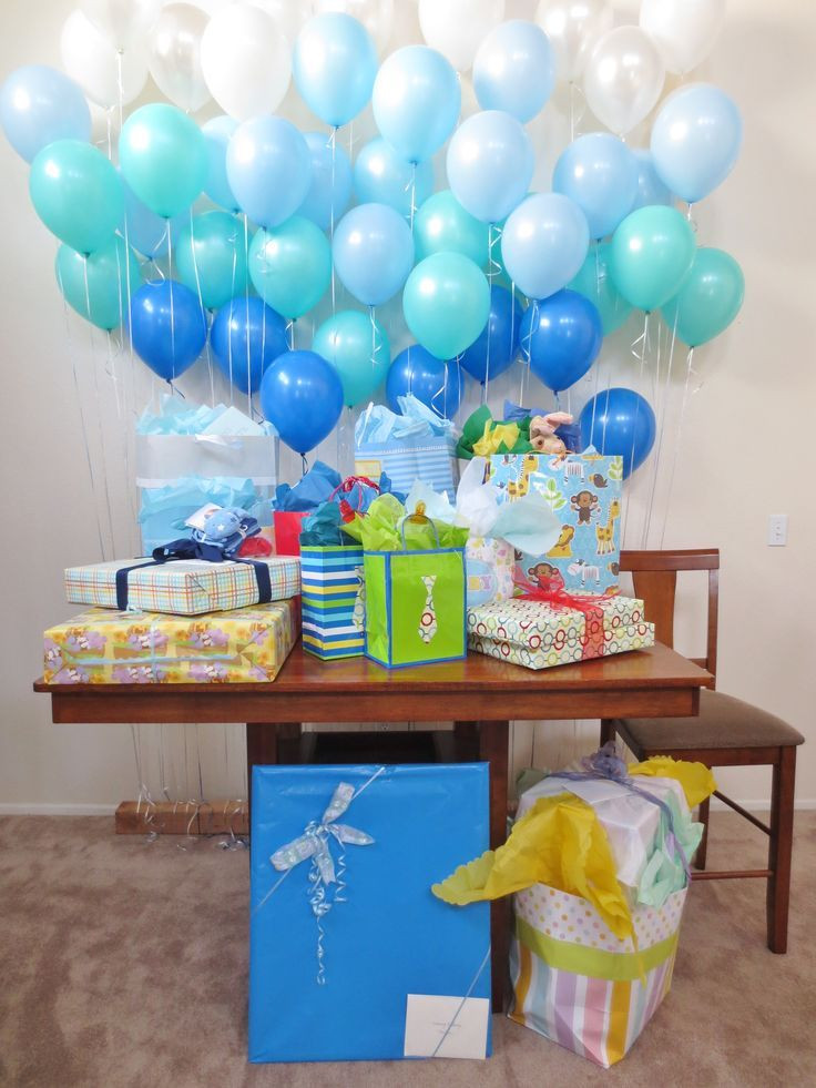 Decorating Ideas For Baby Shower Gift Table
 Tie single balloons behind a t table or food table or