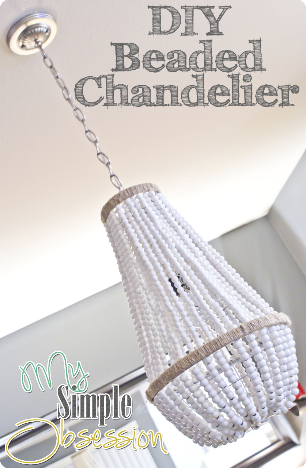 DIY Wood Bead Chandelier
 Upcycle a Plain Chandelier into a Beaded Showpiece