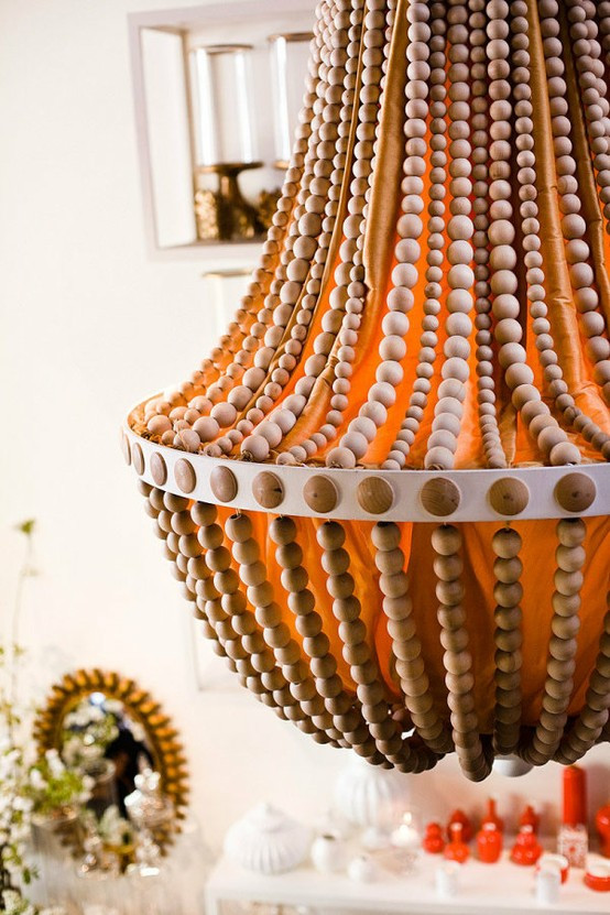 DIY Wood Bead Chandelier
 Upcycle a Plain Chandelier into a Beaded Showpiece