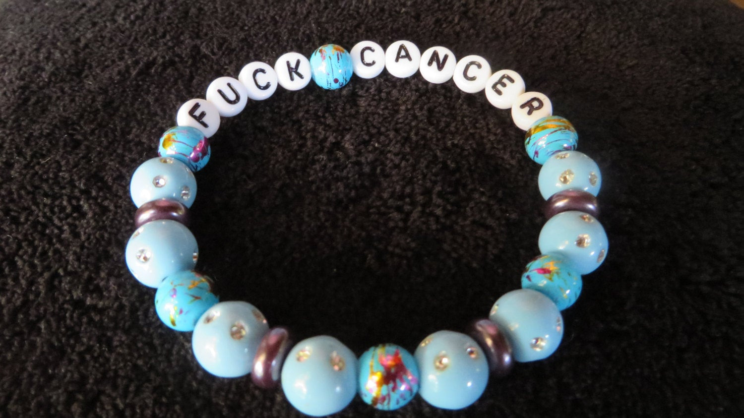 Fuck Cancer Bracelet
 FUCK CANCER stretch bracelet earth strong 7 5 inches