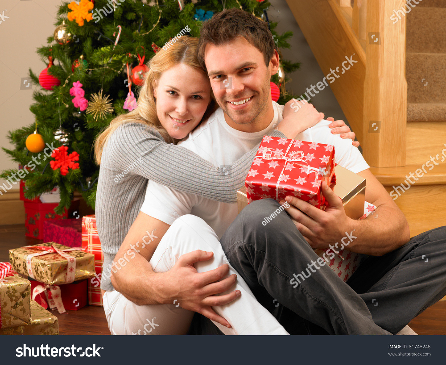 Gift Ideas For Young Couple
 Young Couple With Gifts In Front Christmas Tree Stock