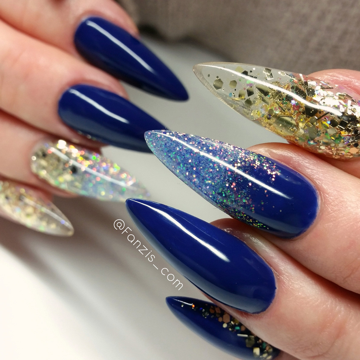 Glitter Pointy Nails
 Blue glitter pointy nails