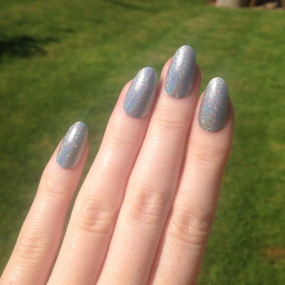 Glitter Pointy Nails
 Holographic silver & glitter oval nails Nail by