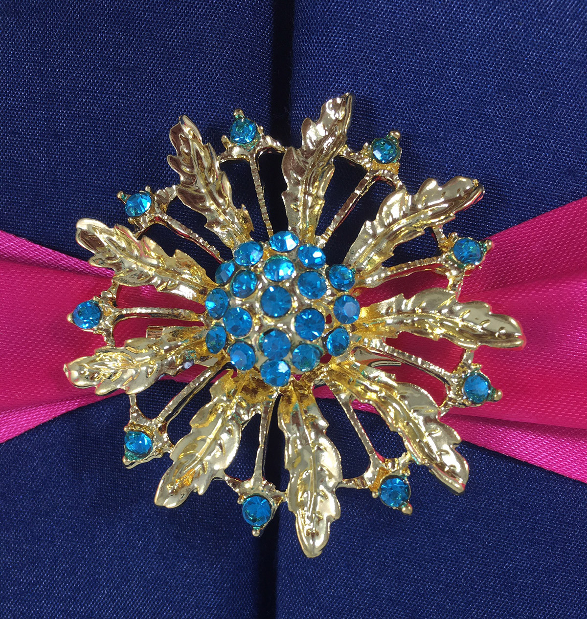 Gold Brooches
 Navy Blue Wedding Folder With Fuchsia Ribbon & Gold Flower