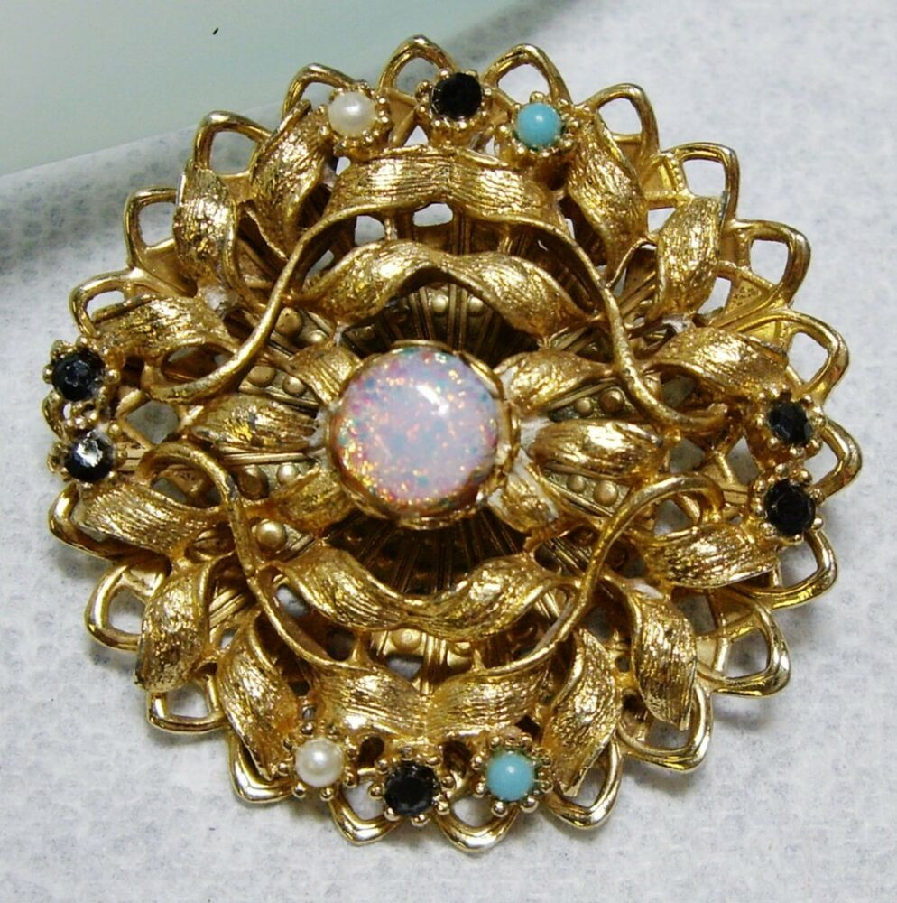 Gold Brooches
 Vintage Gold Tone Harlequin Glass Rhinestone Brooch
