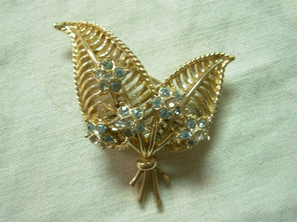 Gold Brooches
 VINTAGE SIGNED CORO GOLD TONE 2 LEAF BROOCH PIN WITH BLUE