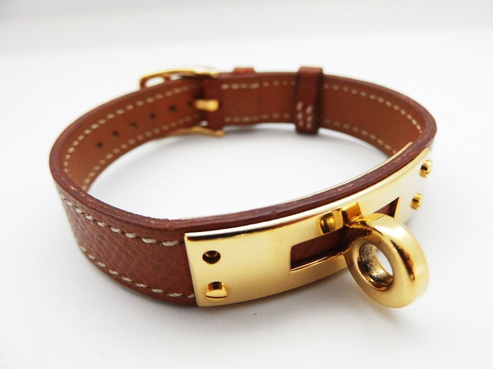 Hermes Kelly Bracelet
 Authentic HERMES Kelly bracelet Browon tone belt gold
