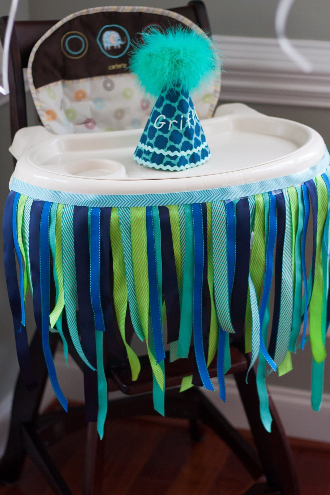 High Chair Birthday Decorations
 Decorated high chair with ribbon and custom birthday party