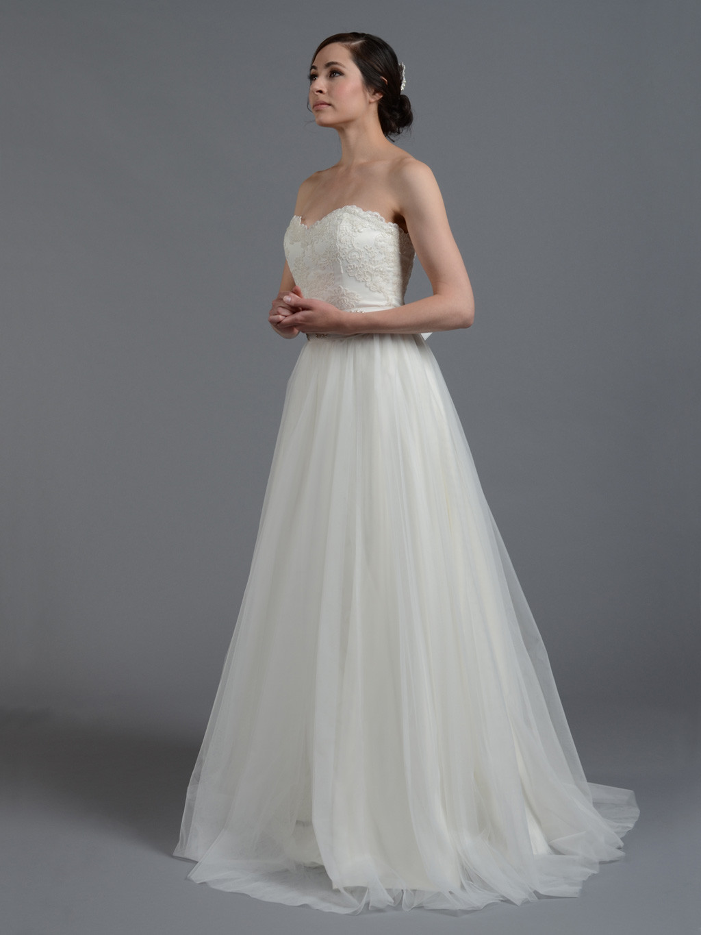 Lace And Tulle Wedding Dress
 Ivory strapless lace wedding dress with tulle skirt