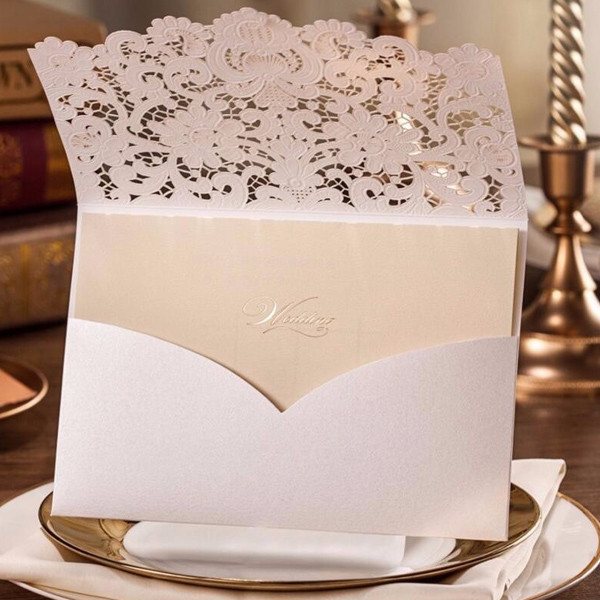 Laser Cut Lace Wedding Invitations
 Elegant ivory lace detailed laser cut wedding invitations