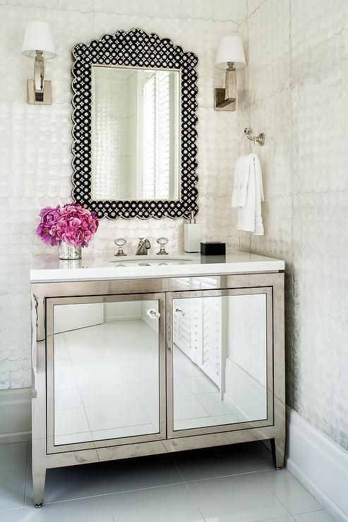 Metal Bathroom Vanity
 Metal bath vanity with mirrored cabinet doors