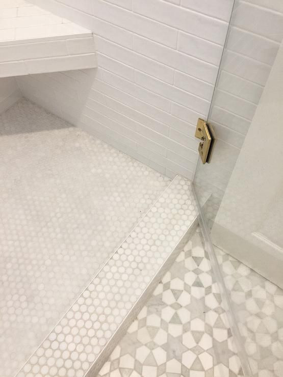 Penny Round Tile Bathroom Floor
 New Ravenna Medina Tiles lead to a glass door opening to a