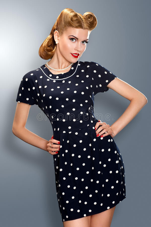 Pins Up Style
 Pin up Girl In Retro Vintage Dress Posing Stock Image