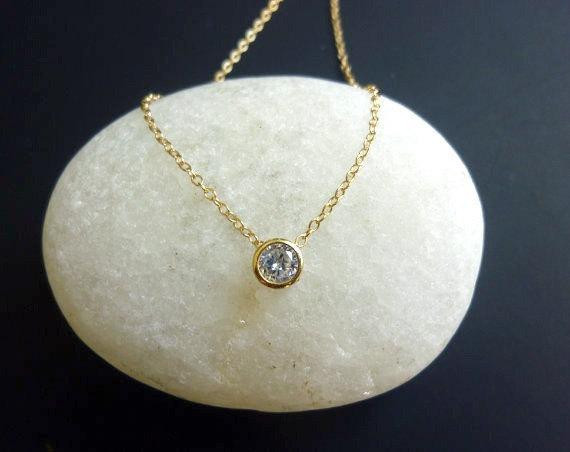 Tiny Diamond Necklace
 tiny diamond look necklace in gold bezel set by MomentusNY