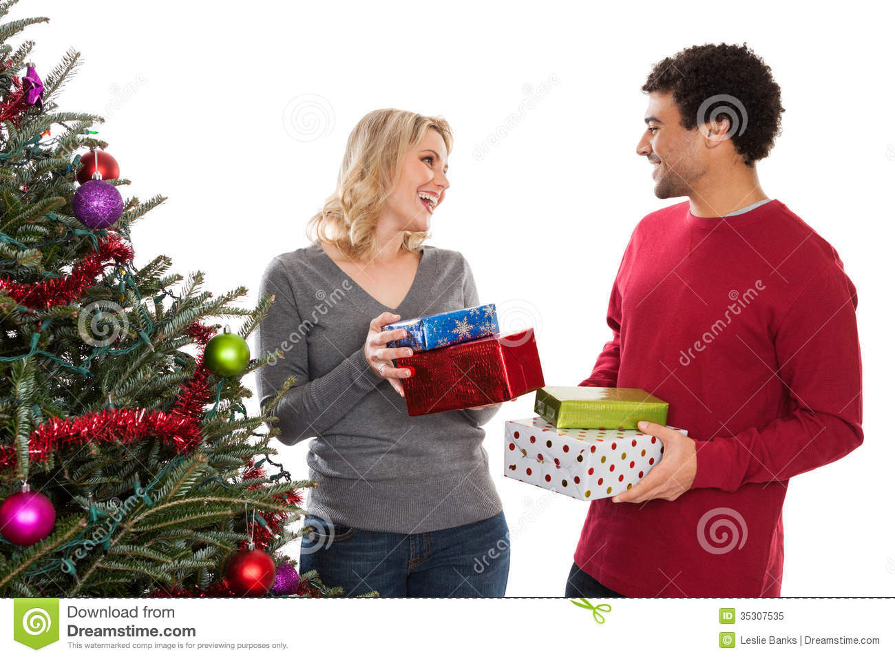 Wedding Gift Ideas For Middle Aged Couple
 Christmas Couple Giving Gifts Royalty Free Stock