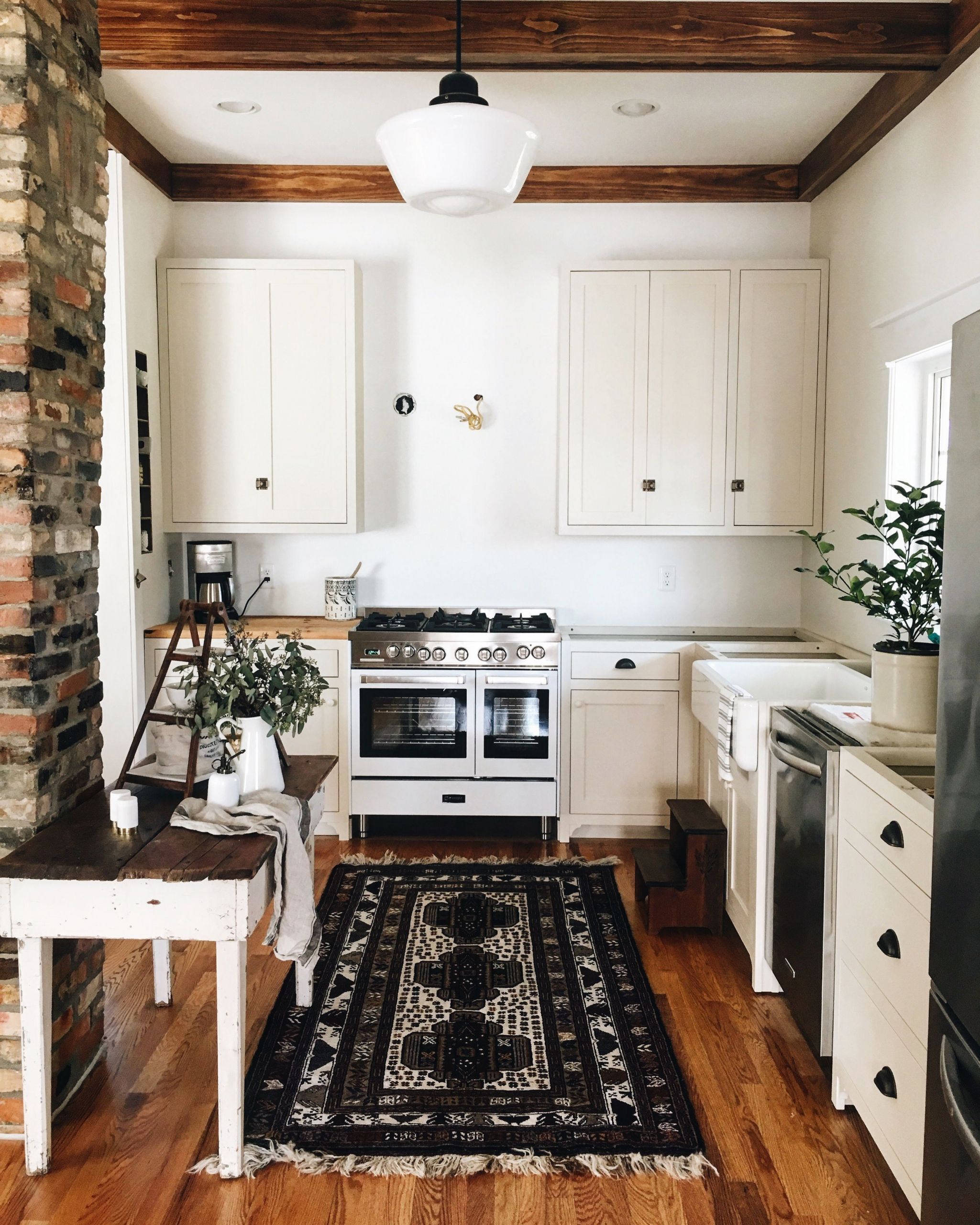 White Kitchen Rugs
 Warm kitchen with wood flooring wood beams and white