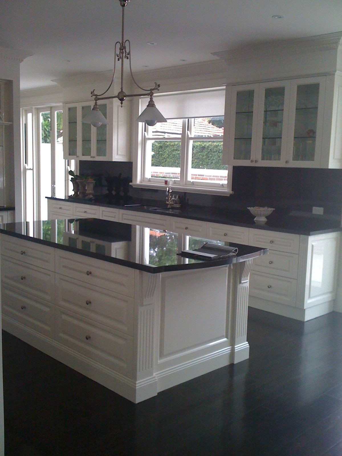 White Kitchen With Black Granite
 Indah island white cabinets with black granite benchtops