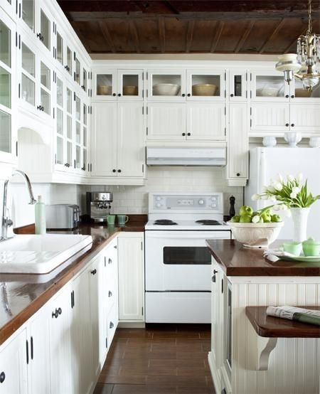 White Kitchen With White Appliances
 Stunning white kitchen design with off white beadboard