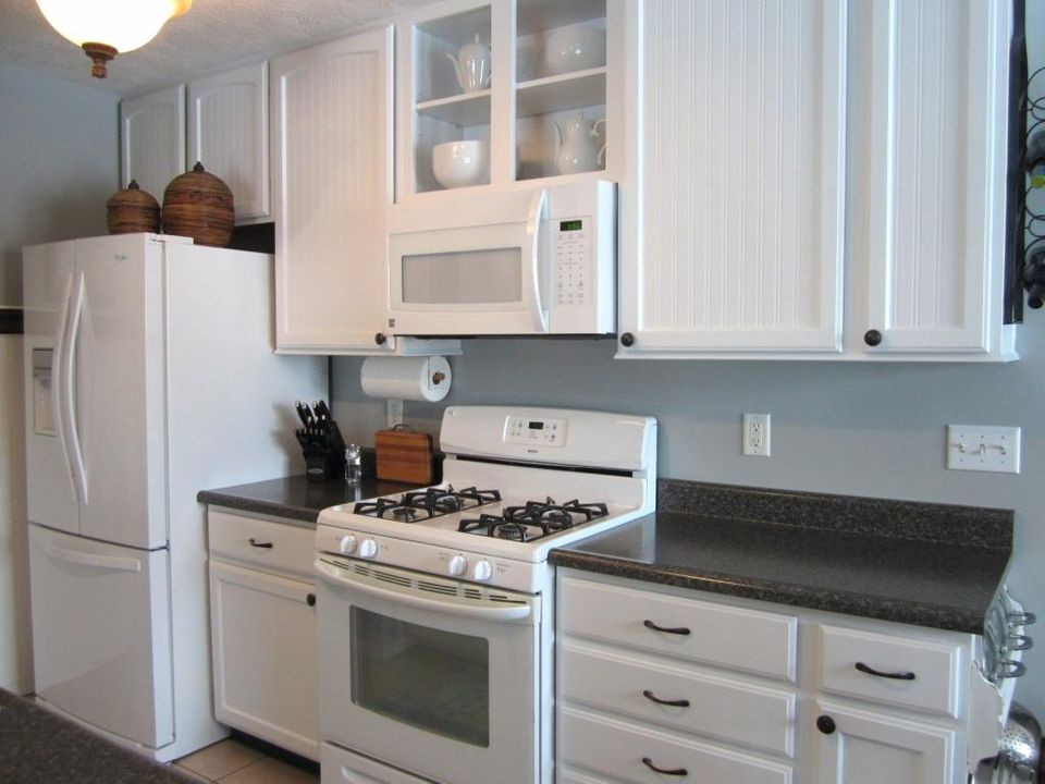 White Kitchen With White Appliances
 Cabinet paint that matches white kitchen appliances