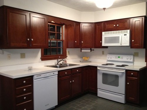 White Kitchen With White Appliances
 Brown cabinets white corian countertop w white appliances