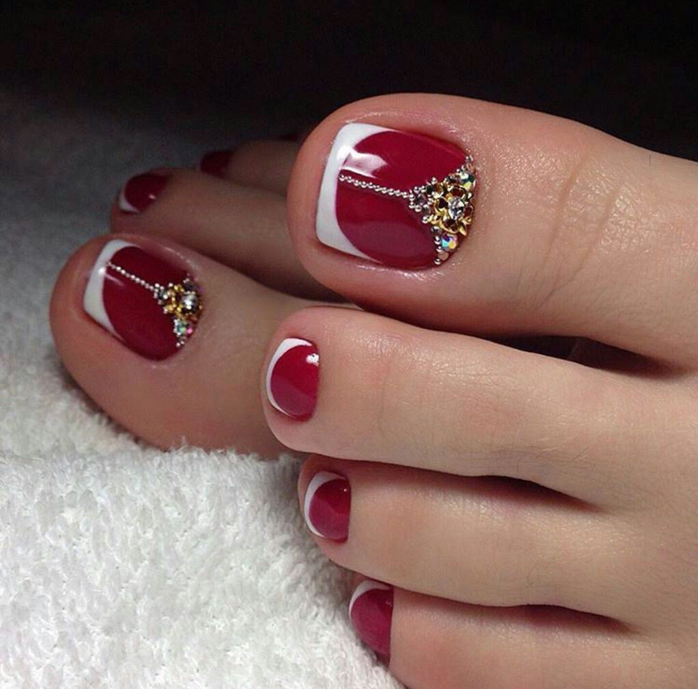 White Tip Toe Nail Designs
 Red toe nails with white french tip and rhinestones