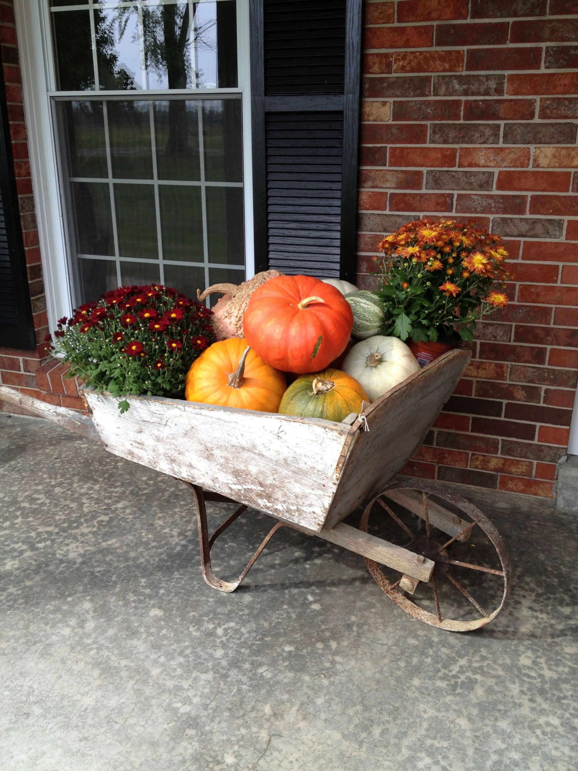 Fall Wheelbarrow Decor
 Front porch decoration Antique wooden wheelbarrow with