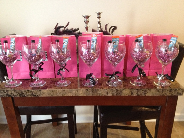 Girlfriend Getaway Gift Ideas
 Girls Trip Gifts A wine glass with shot bottles and a
